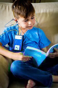 20170707 Neuroptimal Stock 252-child-reading-during-neurofeedback-session