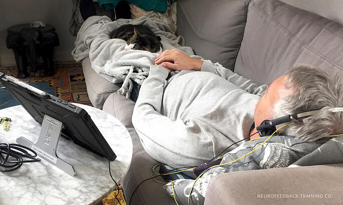 man sleeping during a neuroptimal session