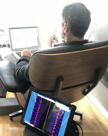 man-doing-neurofeedback-session-at-home-with-neuroptimal-equipment