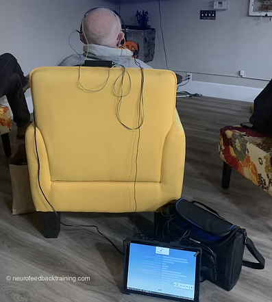 senior watching TV during a neurofeedback session using the neuroptimal braintraining system